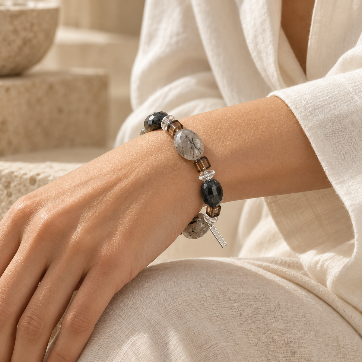 Model wearing the Smoky Ink gemstone bracelet