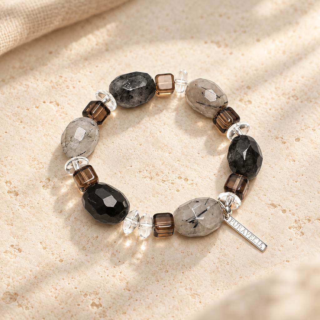 Smoky Ink rutilated quartz and tea crystal bracelet studio view
