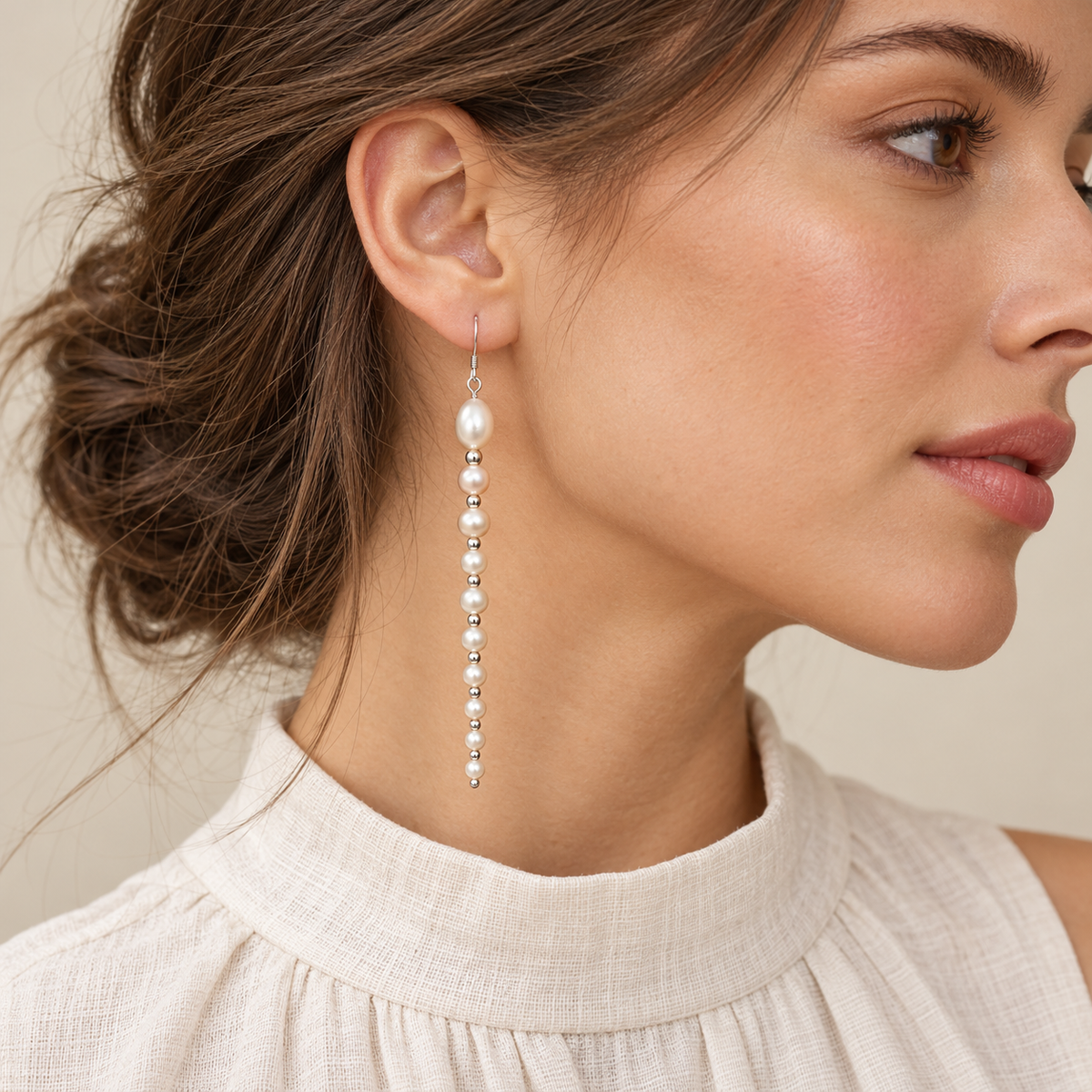 White Ripple pearl drop earring worn by model