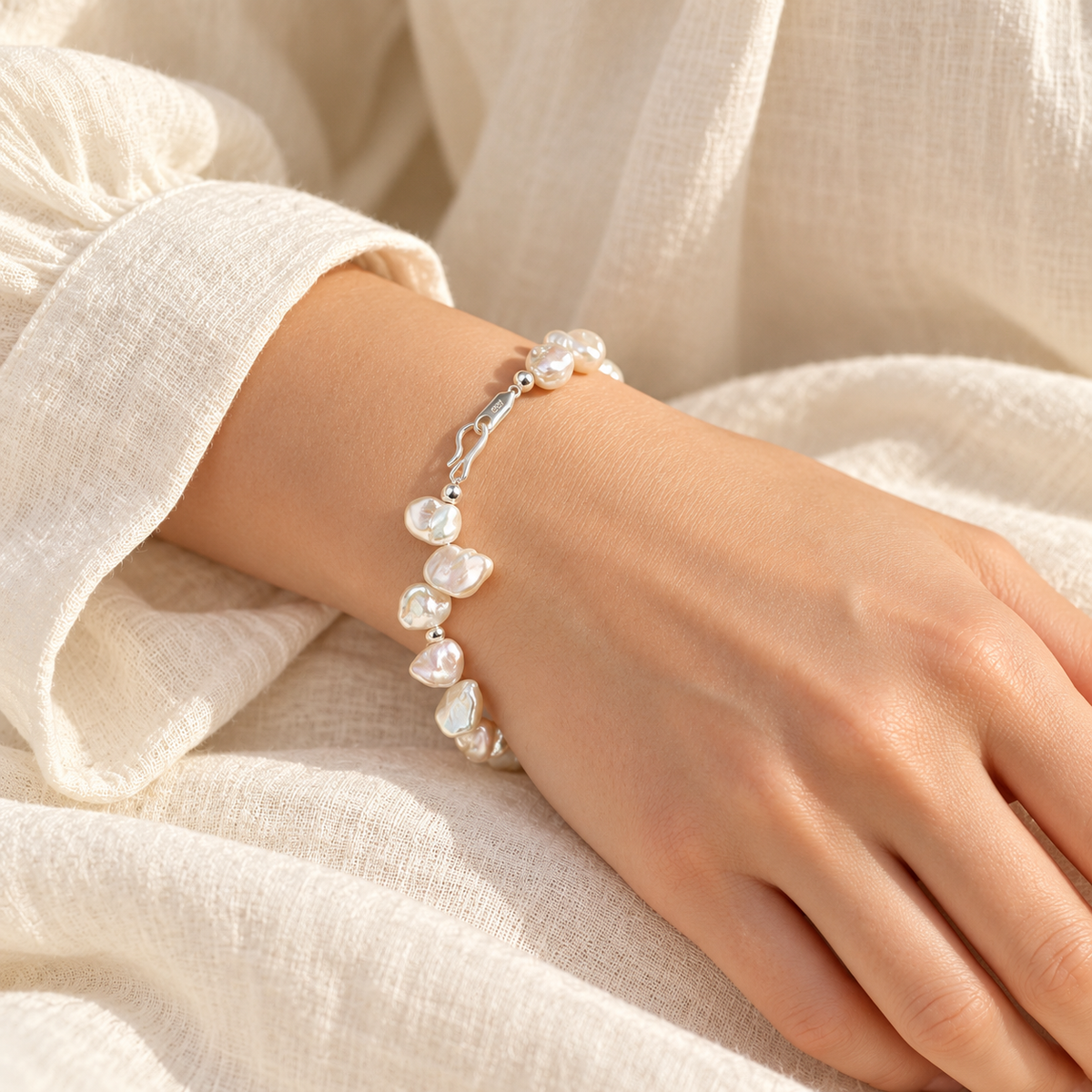 Cloud Petal pearl bracelet worn on wrist