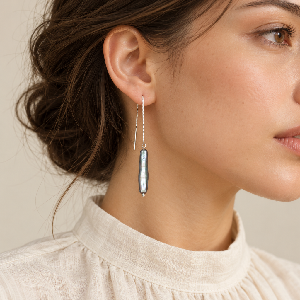 Smoky Veil gray pearl threader earring worn by model