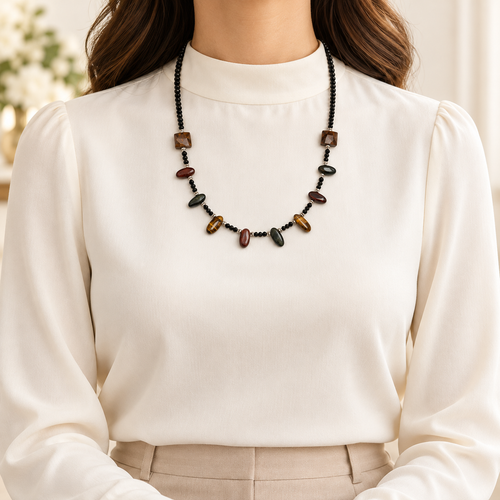 Model wearing the Obsidian Glow tiger's eye and black tourmaline necklace